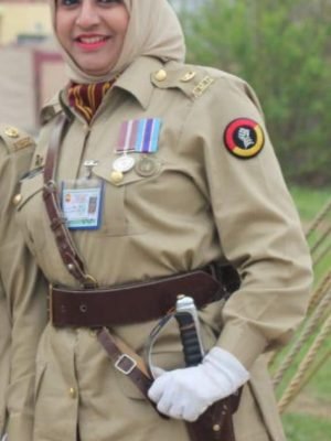 Pakistani female military officer in full ceremonial uniform with sword during 23rd March Pakistan Day Parade.