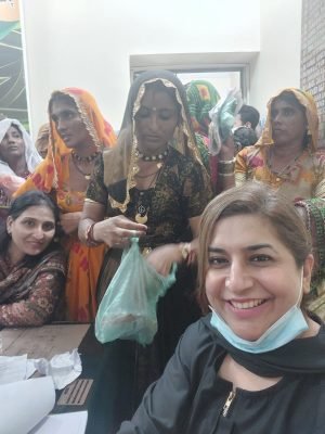 Dr. Hina Urooj smiling with a group of happy and satisfied patients after successful medical treatment at her clinic.